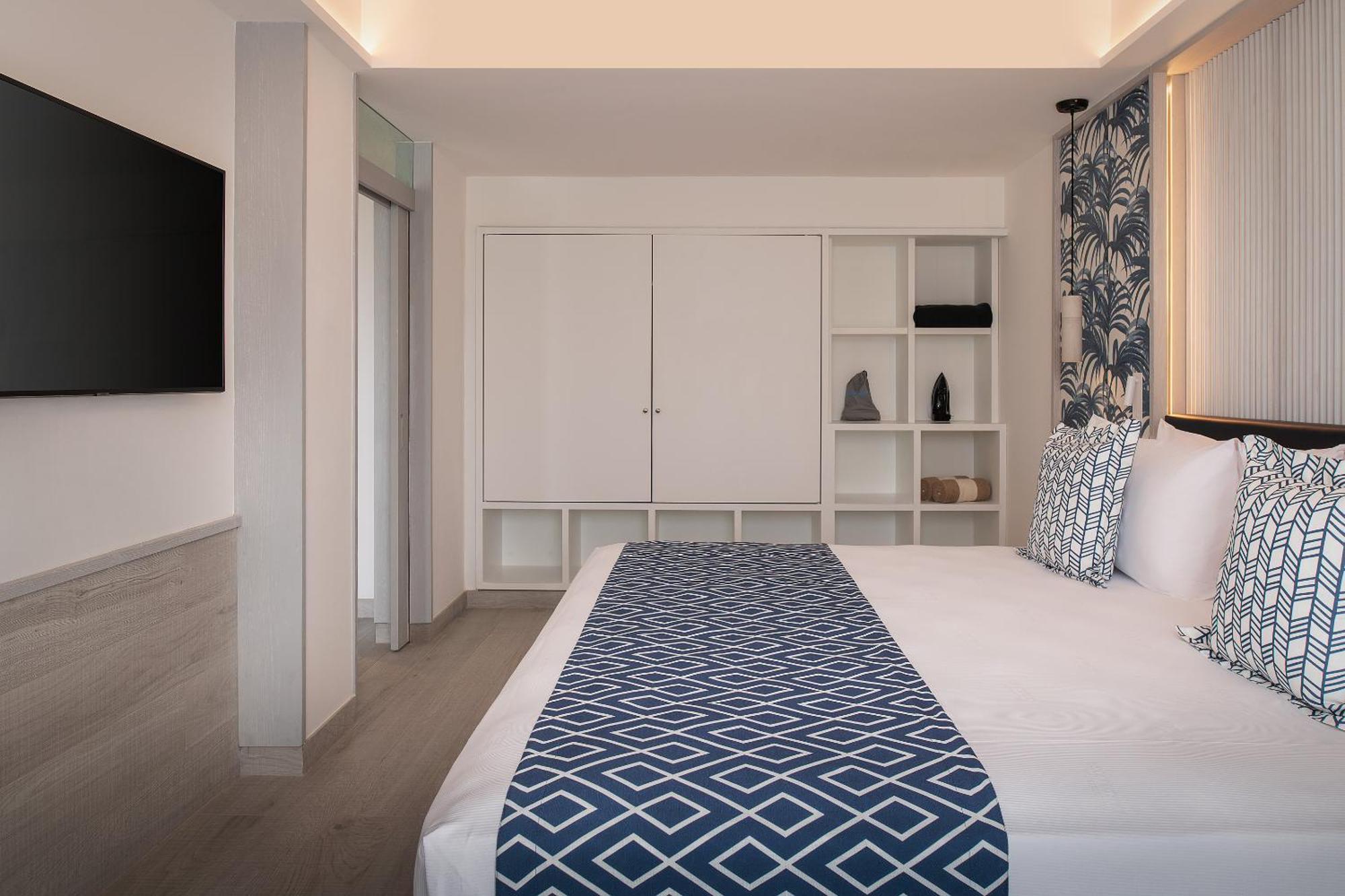 Catalonia Grand Costa Mujeres All Suites & Spa Cancun Room photo A bedroom at the hotel